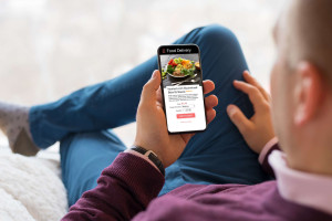 man-scrolling-food-delivery-app-colin-austin-gbiota