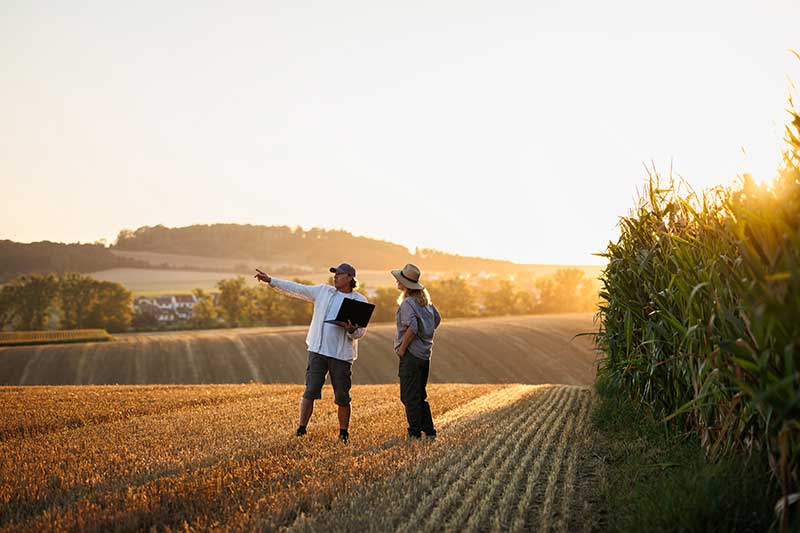 two-people-on-farm-discussing-innovation-colin-austin-gbiota