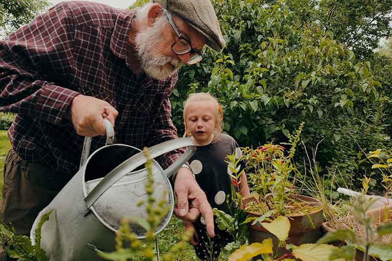 community-man-and-girl-gardening-guidance-colin-austin-gbiota
