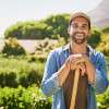 man-smiling-while-gardening-colin-austin-gbiota