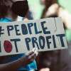 people-not-profit-protest-sign-colin-austin-gbiota