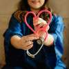doctor-holding-stethoscope-heart-shape-colin-austin-gbiota