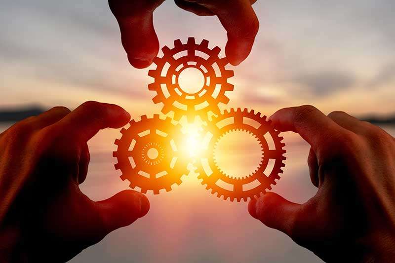 hands-turning-gears-engineering-innovation