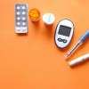 insulin-pen-diabetes-measurement-tools-orange-background-colin-austin-gbiota