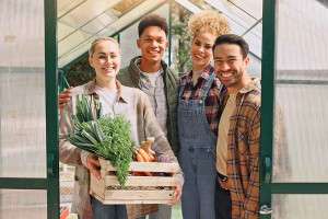 people-smiling-in-greenhouse-gardening-colin-austin-gbiota